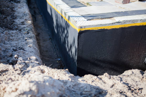 Professional Basement Waterproofing technician working in Chapel Hill, NC